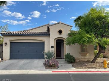 Charming single-story home featuring a well-kept front yard and a two-car garage at 519 Via Garofano Ave, Henderson, NV 89011