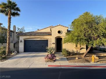 Charming single-story home with desert landscaping, attached garage, and inviting entrance at 519 Via Garofano Ave, Henderson, NV 89011