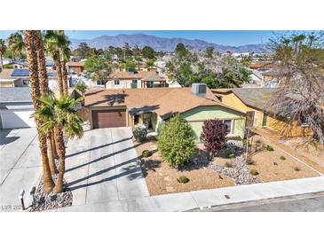Charming single-story home features a well-maintained yard and a convenient attached garage at 6520 Ouida Way, Las Vegas, NV 89108
