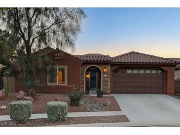 Charming single-story home with a well-maintained front yard and attached two car garage at 8113 Bay Colony St, Las Vegas, NV 89131