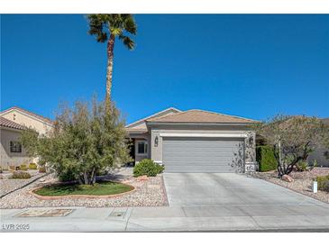 Charming single-story home features a low-maintenance desert landscaped yard, driveway, and a two car garage at 1372 Couperin Dr, Henderson, NV 89052