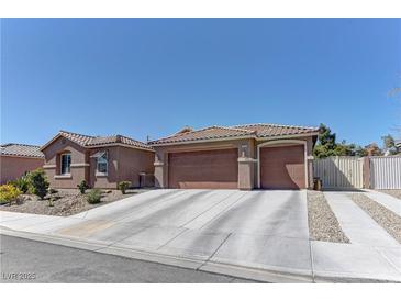 Charming single-story home featuring a spacious driveway and well-maintained landscaping at 5629 Portage Lake Ct, Las Vegas, NV 89130
