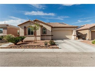 Charming single-story home with a desert-landscaped front yard, tile roof, and two-car garage at 7386 Campbell Ranch Ave, Las Vegas, NV 89179
