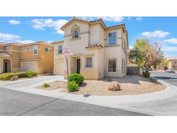 Charming two-story home featuring low maintenance landscaping and a quaint front facade at 9785 Iron Mine St, Las Vegas, NV 89183