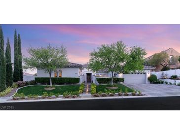 Charming single-story home featuring a tile roof, manicured lawn, and mature trees at 10717 Beringer Dr, Las Vegas, NV 89144
