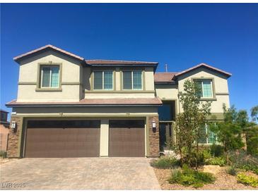 Beautiful two-story home featuring a spacious three-car garage and manicured landscaping at 3921 Jacob Lake Cir, Las Vegas, NV 89118