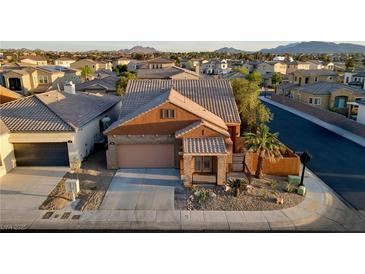 Charming single-story home featuring desert landscaping and a tile roof in a desirable community at 437 Via Stretto Ave, Henderson, NV 89011