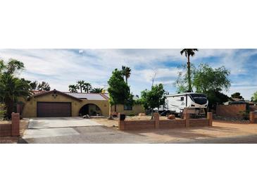 Charming single-story home featuring a well-manicured front yard and a private driveway at 5312 Manuel Dr, Las Vegas, NV 89149