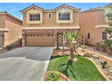 Charming two-story home features a well-maintained lawn, complemented by a two car garage and a stone facade at 6053 Lambert Bridge Ave, Las Vegas, NV 89139