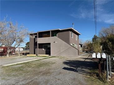 Two-story building features a simple design and exterior staircases providing access to the upper units at 641 West St, Pahrump, NV 89048
