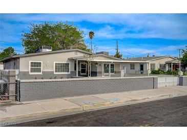 Charming single-story home featuring a well-maintained front yard and a quaint covered porch entrance at 700 Cactus Ln, Las Vegas, NV 89107