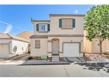 Charming two-story home with green shutters and a well-maintained front yard at 9958 Fragile Fields St, Las Vegas, NV 89183