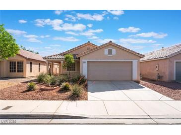 Charming single-story home with a two-car garage and a well-maintained front yard at 7116 Wonderberry St, Las Vegas, NV 89131