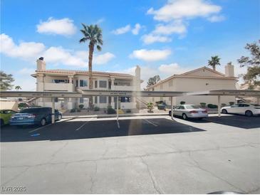 Exterior shot showcasing the covered parking area available to residents, and the exterior of the property at 913 Boulder Springs Dr # 202, Las Vegas, NV 89128