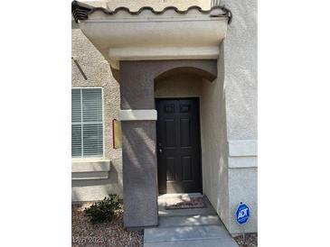 Exterior shot of the front door and porch with ADT security sign visible at , Las Vegas, NV 89148