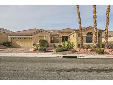 Inviting single-story home featuring desert landscaping and a two-car garage at 1779 Sebring Hills Dr, Henderson, NV 89052