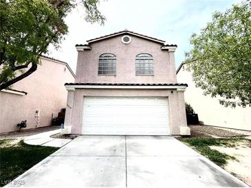 Charming two-story home with a two-car garage and well-maintained front yard at 5359 Harvest Breeze Rd, Las Vegas, NV 89118