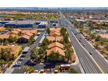 An aerial view of a vibrant neighborhood showcasing well-maintained buildings, lush greenery, and convenient street access at 7950 W Flamingo Rd # 1003, Las Vegas, NV 89147