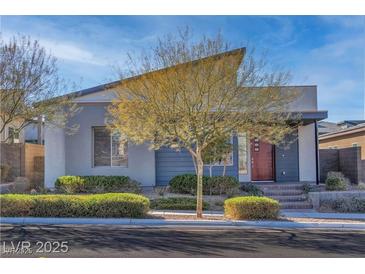 Charming single-story home with unique architectural design and well-manicured front yard landscaping at 2494 Veronella St, Henderson, NV 89044