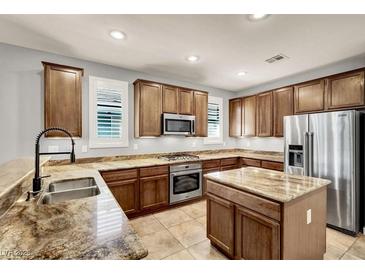 Features granite countertops, stainless steel appliances and lots of cabinet space for optimal storage at 7806 Sundial Peak St, Las Vegas, NV 89166