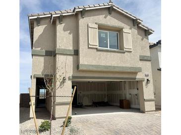 Two-story house with a two-car garage and a neutral colored paint at 10382 Luna Mezzo St Ave # Lot 196, Las Vegas, NV 89141