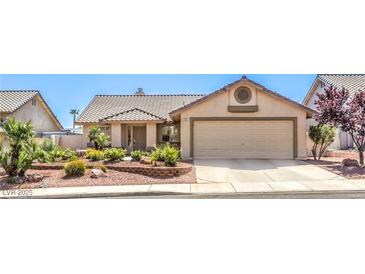 Charming single-story home with a two car garage and desert landscaping in a quiet neighborhood at 133 Park Ridge Ln, Henderson, NV 89002