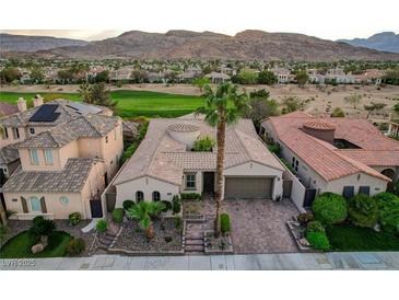 Stunning single-Gathering home featuring a desert landscaped yard, a tile roof, and an attached two-car garage at 2885 Red Springs Dr, Las Vegas, NV 89135