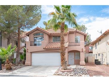 Charming two-story home features a well-manicured yard, two-car garage, and classic southwest architecture at 3025 Yankee Clipper Dr, Las Vegas, NV 89117