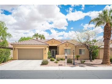 Charming single-story home with a well-manicured front yard, desert landscaping, and a tile roof at 3696 Waynesvill St, Las Vegas, NV 89122