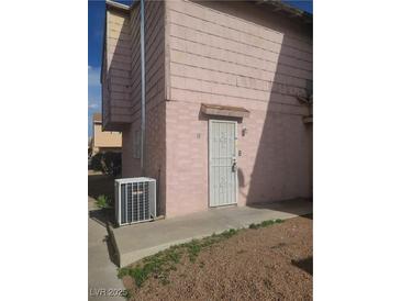 Image shows the building's exterior with a secure, gated door at 5248 Greene Ln # B, Las Vegas, NV 89119