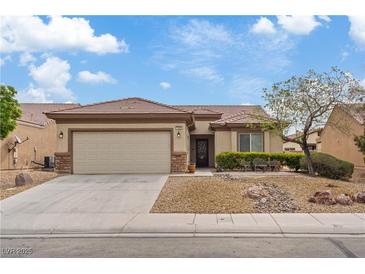 Charming single-story home with a desert landscaped yard and a two-car garage at 7452 Chaffinch St, North Las Vegas, NV 89084