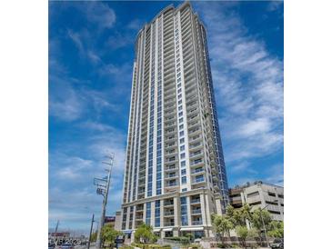 Striking high-rise building with modern architecture, balconies, and abundant windows under a blue, partly cloudy sky at 200 W Sahara Ave # 3312, Las Vegas, NV 89102