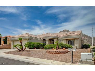 Attractive single-story home with desert landscaping, tile roof, and attached two-car garage at 2721 Faiss Dr, Las Vegas, NV 89134