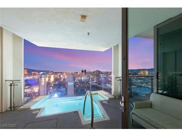 Balcony pool overlooking city with glass railings and seating; enjoy luxurious views from your own private oasis at 4381 W Flamingo Rd # 57306, Las Vegas, NV 89103