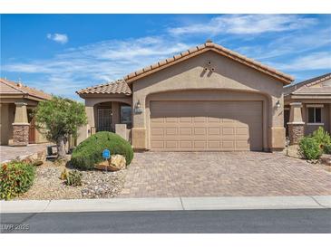 Charming single-story home featuring a well-manicured front yard and a two-car garage with a paved driveway at 6160 Majestic Wind Ave, Las Vegas, NV 89122