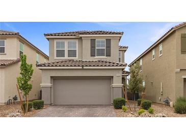 Charming two-story home with a well-manicured front yard and an attached two-car garage at 2293 Teatro Ave, Henderson, NV 89044