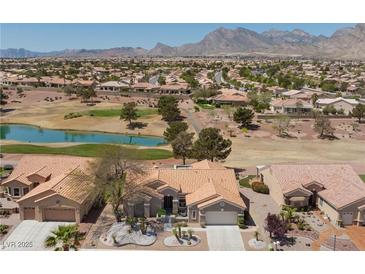 Beautiful single-story home on a golf course with mountain views and a tiled roof at 2317 Sierra Heights Dr, Las Vegas, NV 89134