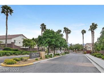 Entrance to the Old Vegas Ranch community shows mature landscaping and well-maintained roadways at 2509 April Breeze Ln, Henderson, NV 89002