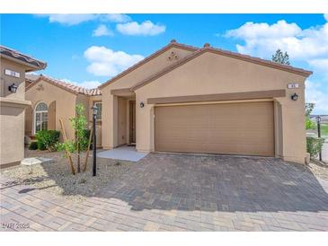 Charming single-story home with a two-car garage and beautifully paved driveway at 45 Via Di Mello, Henderson, NV 89011
