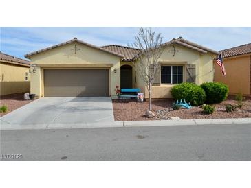 Charming single-story home with a well-manicured front yard and attached two-car garage at 4770 Lorenzo Way, Pahrump, NV 89061