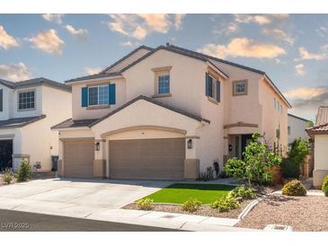 Charming two-story home features a well-manicured lawn and a two-car garage at 6973 Pacific Coast St, Las Vegas, NV 89148