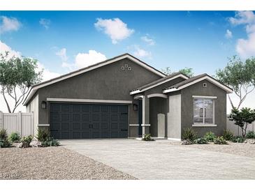 Charming single-story home features a neutral color palette and a spacious two-car garage at 3225 Walker River St, North Las Vegas, NV 89032