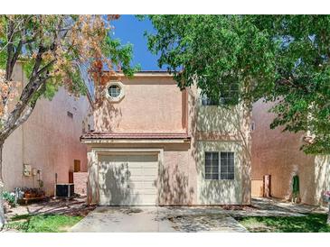 Charming two-story home with a one-car garage and mature trees in a well-maintained neighborhood at 5588 Ness Ave, Las Vegas, NV 89118