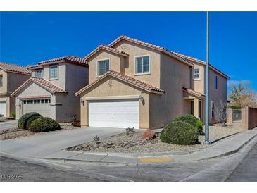 Charming two-story home featuring a two-car garage and low-maintenance landscaping at 6424 Bombax Ct, Las Vegas, NV 89141