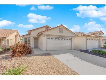 Charming single-story home featuring a low-maintenance desert landscape and an attached two-car garage at 8127 Chambersberg St, Las Vegas, NV 89147