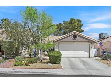 Charming single-story home with a two-car garage, landscaped front yard and inviting curb appeal at 1658 Autumn Rust Dr, Las Vegas, NV 89119