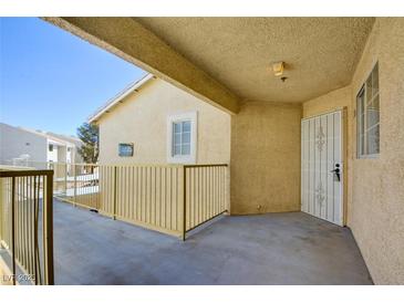 Inviting exterior featuring a secure gated patio, offering privacy and a welcoming entrance to the home at 1979 Cutlass Dr # 1979, Henderson, NV 89014