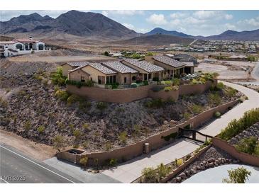 Expansive desert home with stone wall, tiled roof and mountain views at 1123 Christian Rd, Henderson, NV 89002