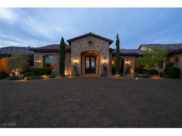 Stunning stone home with a grand entrance and manicured landscaping at 1123 Christian Rd, Henderson, NV 89002
