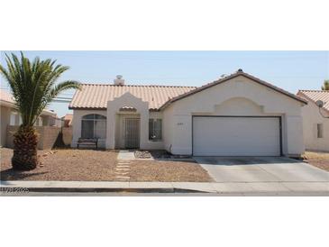 Charming single-story home with stucco exterior, desert landscaping, and attached two-car garage at 3524 Silver Lantern Dr, North Las Vegas, NV 89032